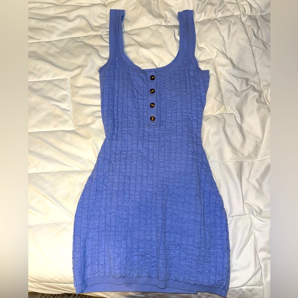 Sleeveless mini dress with buttons